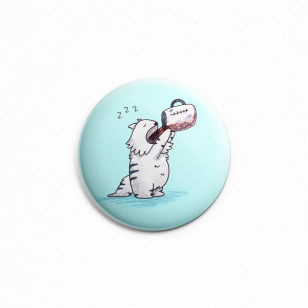 Coffee Cat - Button or magnet with a drawing of a sleepy kitty drinking an entire pot of coffee, probably on a Monday.