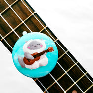 Ukulele Cat - Button or magnet with a digital painting of a cat playing the ukulele and singing.