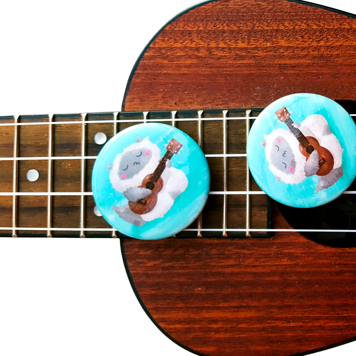 Ukulele Cat - Button or magnet with a digital painting of a cat playing the ukulele and singing by My Cat Is People.